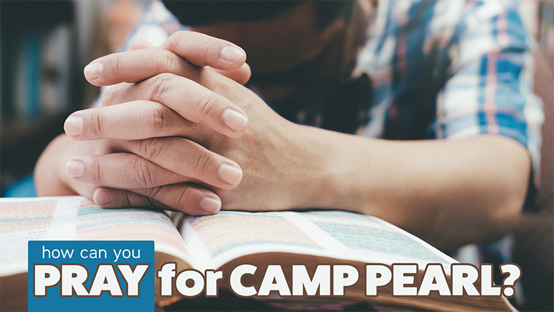 Young man praying with Bible spread open. "How can you pray for Camp Pearl"