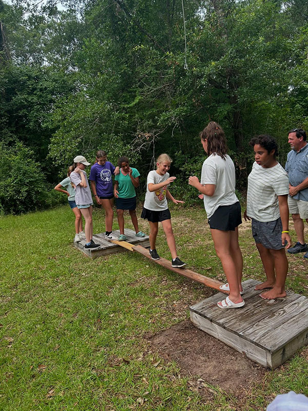 Campers on "Low Ropes" course at Camp Pearl