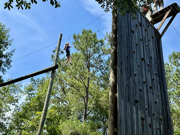 Youth on ropes course at Camp Pearl